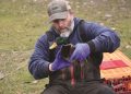Kyle Van Why of the USDA prepares to test a duck for avian flu at Lititz Springs Park.