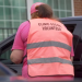 A pro-abortion escort stands outside a Philadelphia Planned Parenthood.