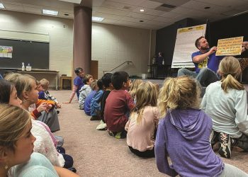 Volunteer Brad Esbenshade leads the children at Landisville Primary Center’s Good News Club in learning 1 Corinthians 10:31.